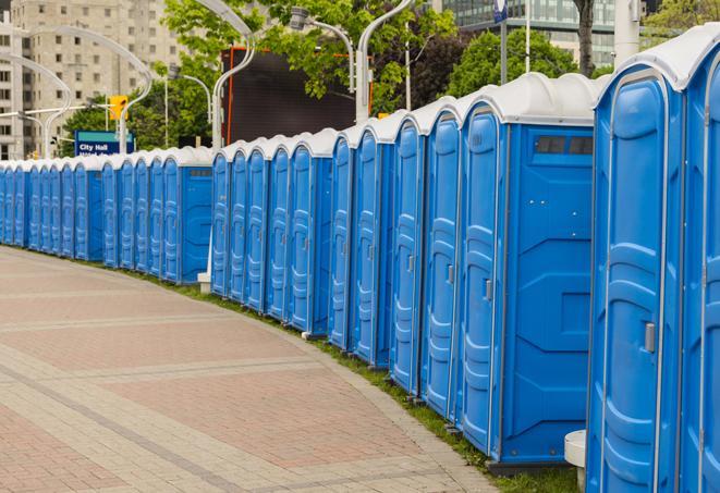 outdoor restroom setup for a special event, with sleek and modern portable restrooms in Bedford